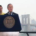 Mayor Bloomberg and artist Olafur Eliasson, with Brooklyn Bridge waterfalls to the right.